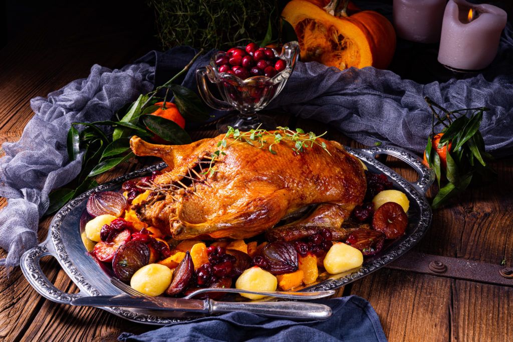 roast duck with potato dumplings and plums