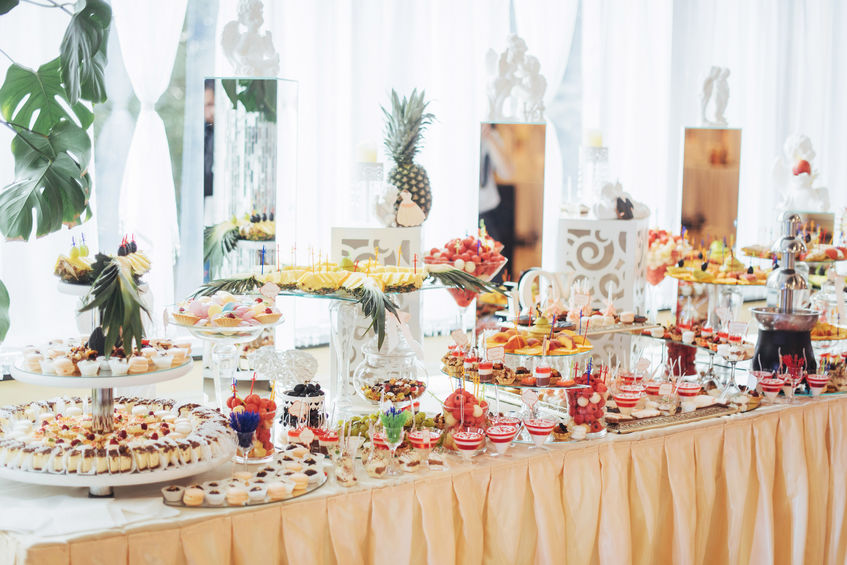 Banquet table full of fruits and berries an assortment