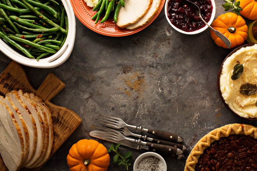 Thanksgiving table with turkey, green beans and mashed potatoes